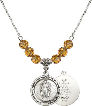 18" Rhodium Plated Necklace with 4mm Topaz Crystal Beads featuring a Sterling Silver Miraculous Medal.