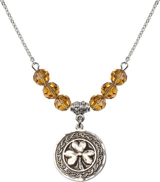 18" Rhodium Plated Necklace with 4mm Topaz Crystal Beads featuring a Sterling Silver Shamrock with Celtic Border Medal.