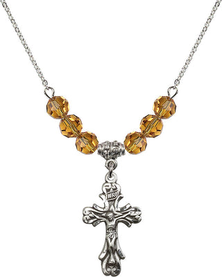 18" Rhodium Plated Necklace with 4mm Topaz Crystal Beads featuring a Sterling Silver Crucifix Medal.