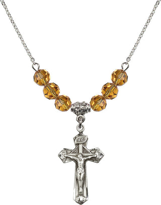 18" Rhodium Plated Necklace with 4mm Topaz Crystal Beads featuring a Sterling Silver Crucifix Medal.