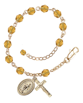 Adjustable Gold Plated 6mm Fire Polished Rosary Bracelet in Topaz