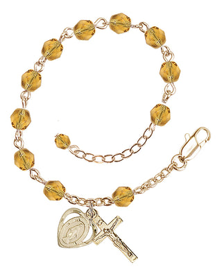 Adjustable Gold Plated 6mm Fire Polished Rosary Bracelet in Topaz