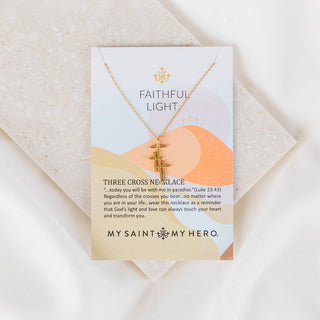 Faithful Light Three Cross Necklace gold on inspirational card