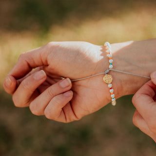 Woman wearing J.O.Y. Bracelets