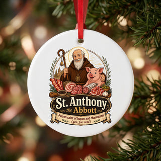 St. Anthony the Abbot Charcuterie Ceramic Ornament hanging on a Christmas tree