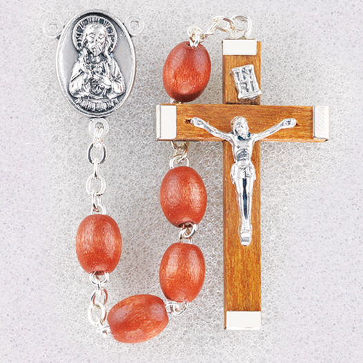 The charm features a St Peter Canisius medal. Silver Plate Rosary Bracelet features 6mm Aqua Fire Polished beads The Crucifix measures 5/8 x 1/4