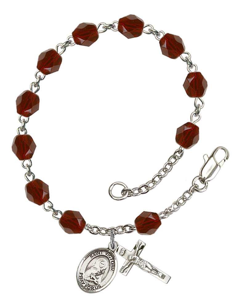 The charm features a St Dominic Savio medal. The Crucifix measures 5/8 x 1/4 Silver Plate Rosary Bracelet features 6mm Amethyst Fire Polished beads